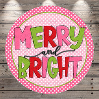 A circular design with the text "MERRY AND BRIGHT" in a stylized font, surrounded by a pink and green polka dot border.