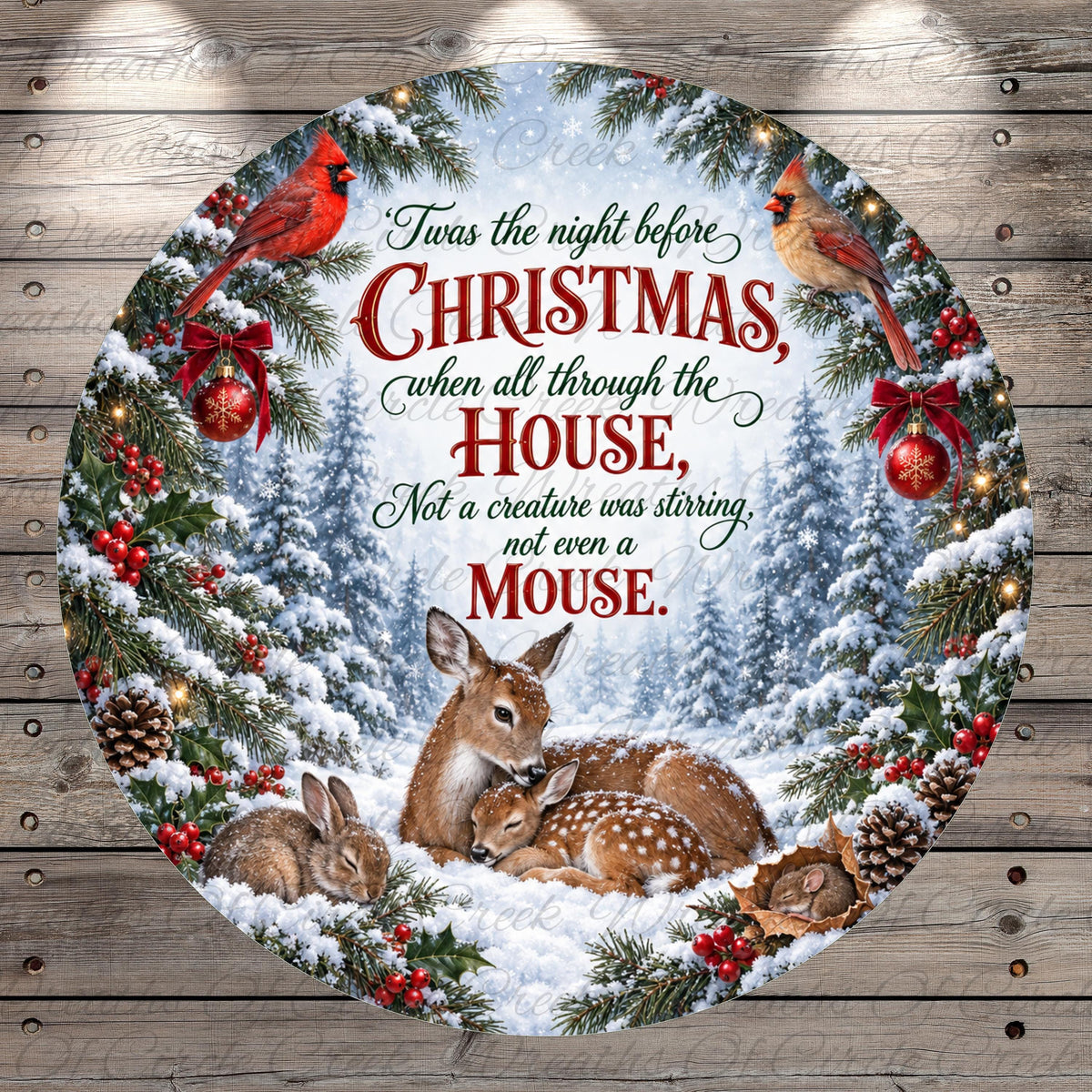 A circular Christmas wreath with a scene of deer, rabbits, and birds in a snowy forest, surrounded by red berries and pine cones. The text on the wreath reads "Twas the night before Christmas when all through the house, not a creature was stirring, not even a mouse."