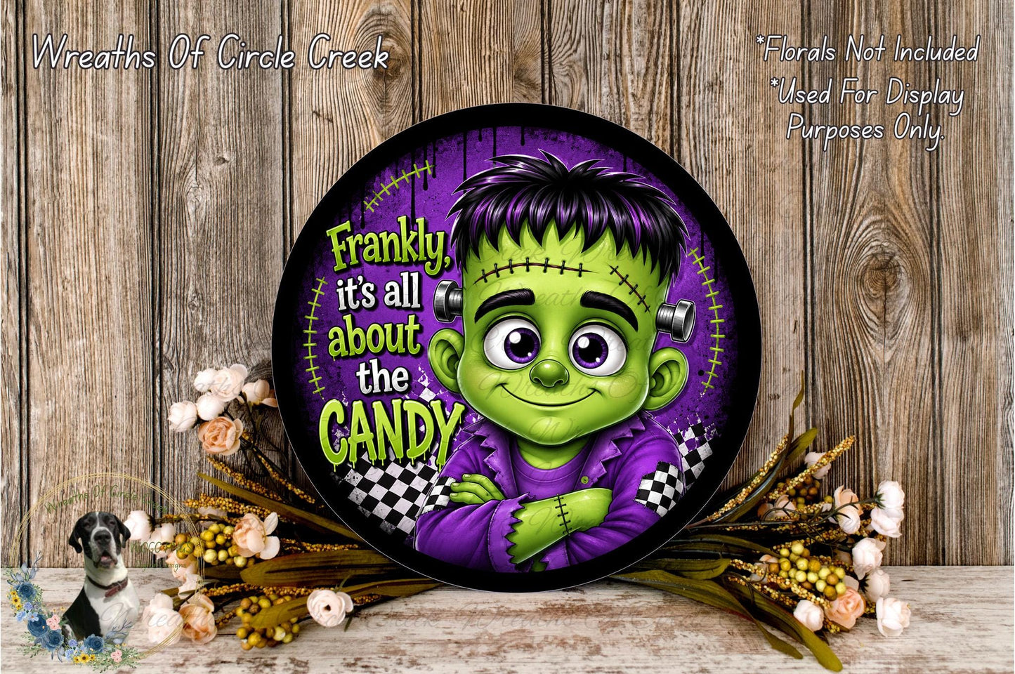 A round wall decoration featuring a cartoon character with a green skinned face and purple clothing, surrounded by flowers and a wooden background.