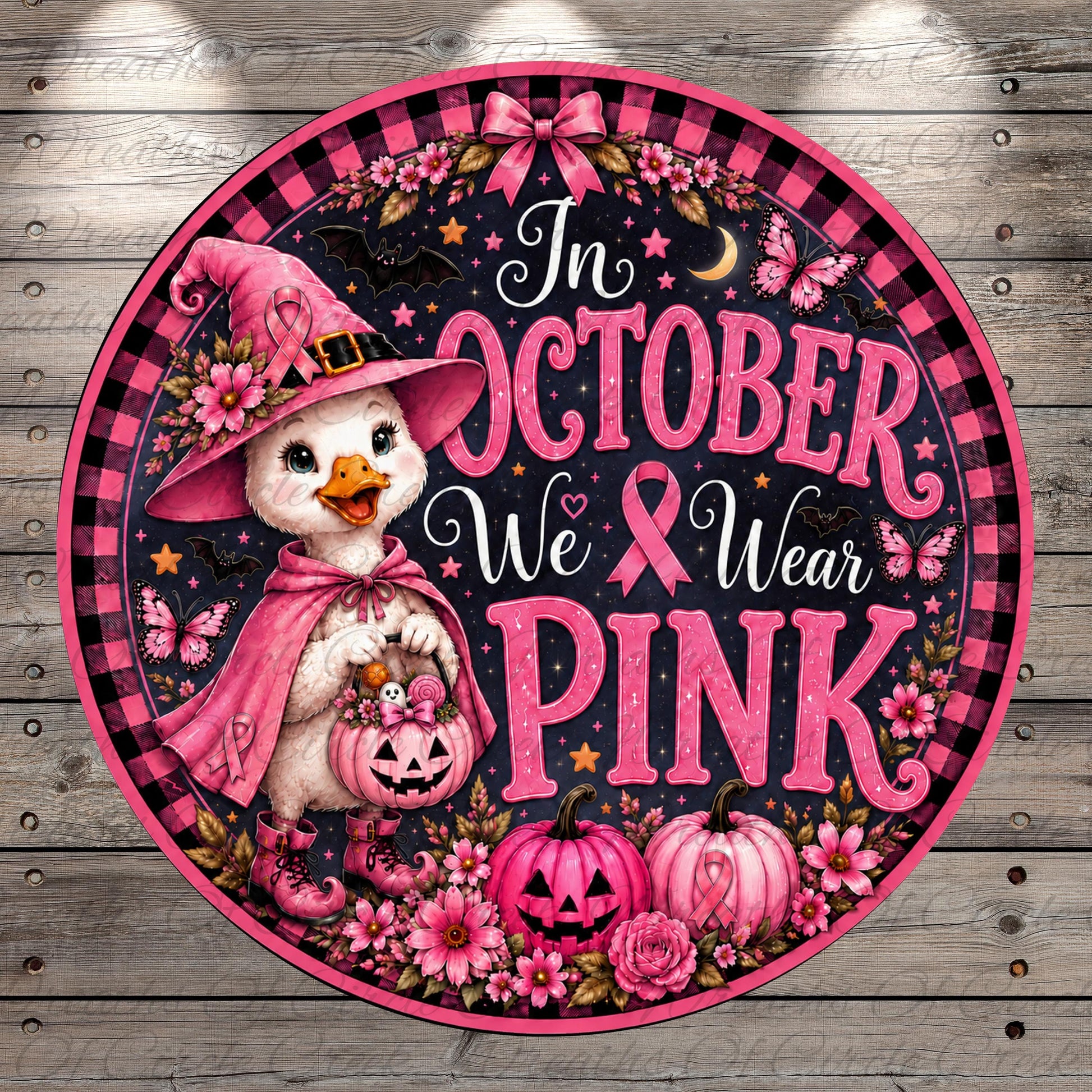 A decorative sign with a cartoon duck wearing a witch's hat and holding a pumpkin, surrounded by pink flowers and pumpkins, with the text "In October We Wear Pink" and a pink ribbon symbol.