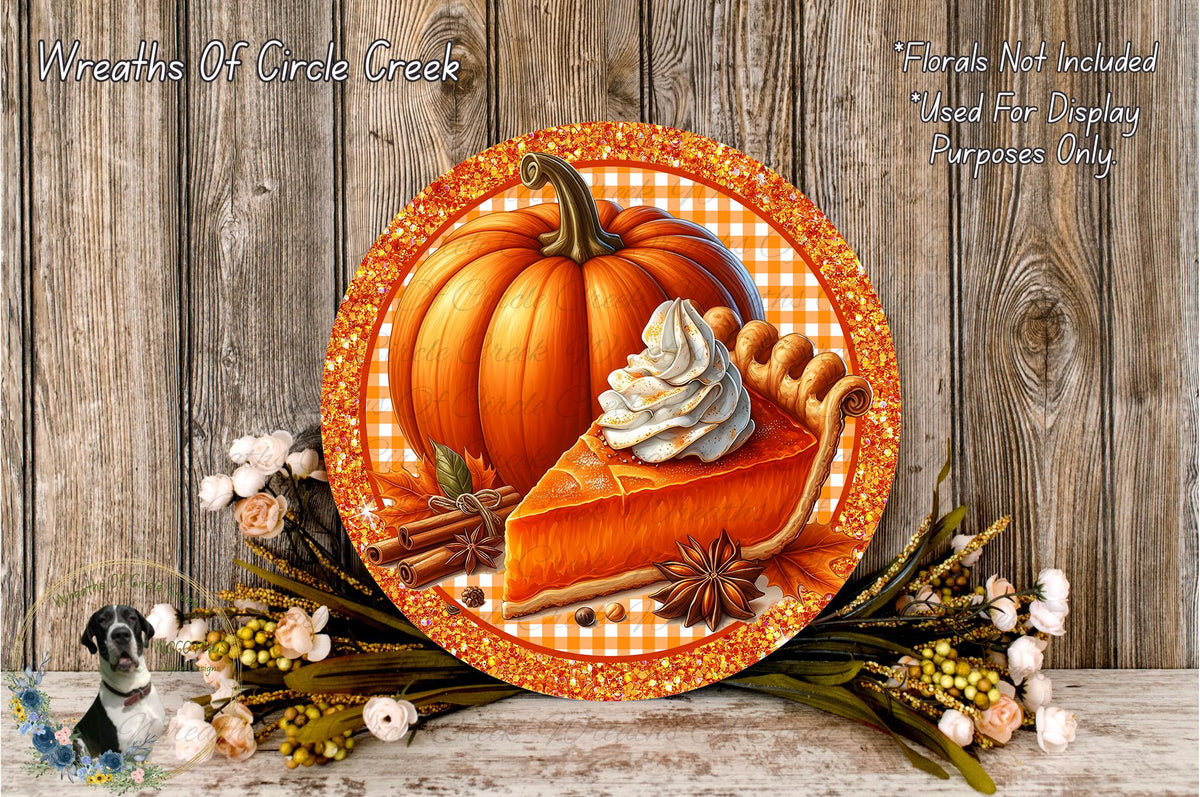A decorative plate featuring a slice of pumpkin pie, a whole pumpkin, and fall-themed decorations such as flowers and herbs, all set against a rustic wooden background.