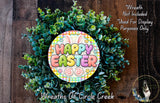 a wreath made of green leaves and flowers, with a colorful sign that says "Happy Easter" in the center. The wreath is displayed on a wooden surface, and there is a small dog in the bottom right corner of the image.