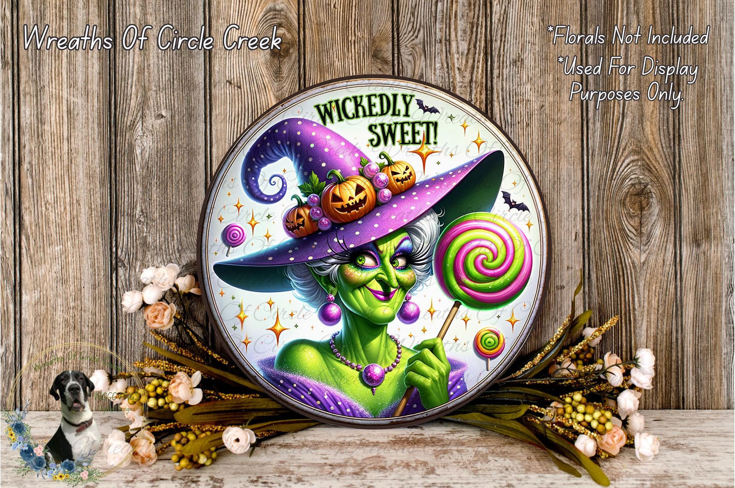 a picture of a witch holding a lollipop