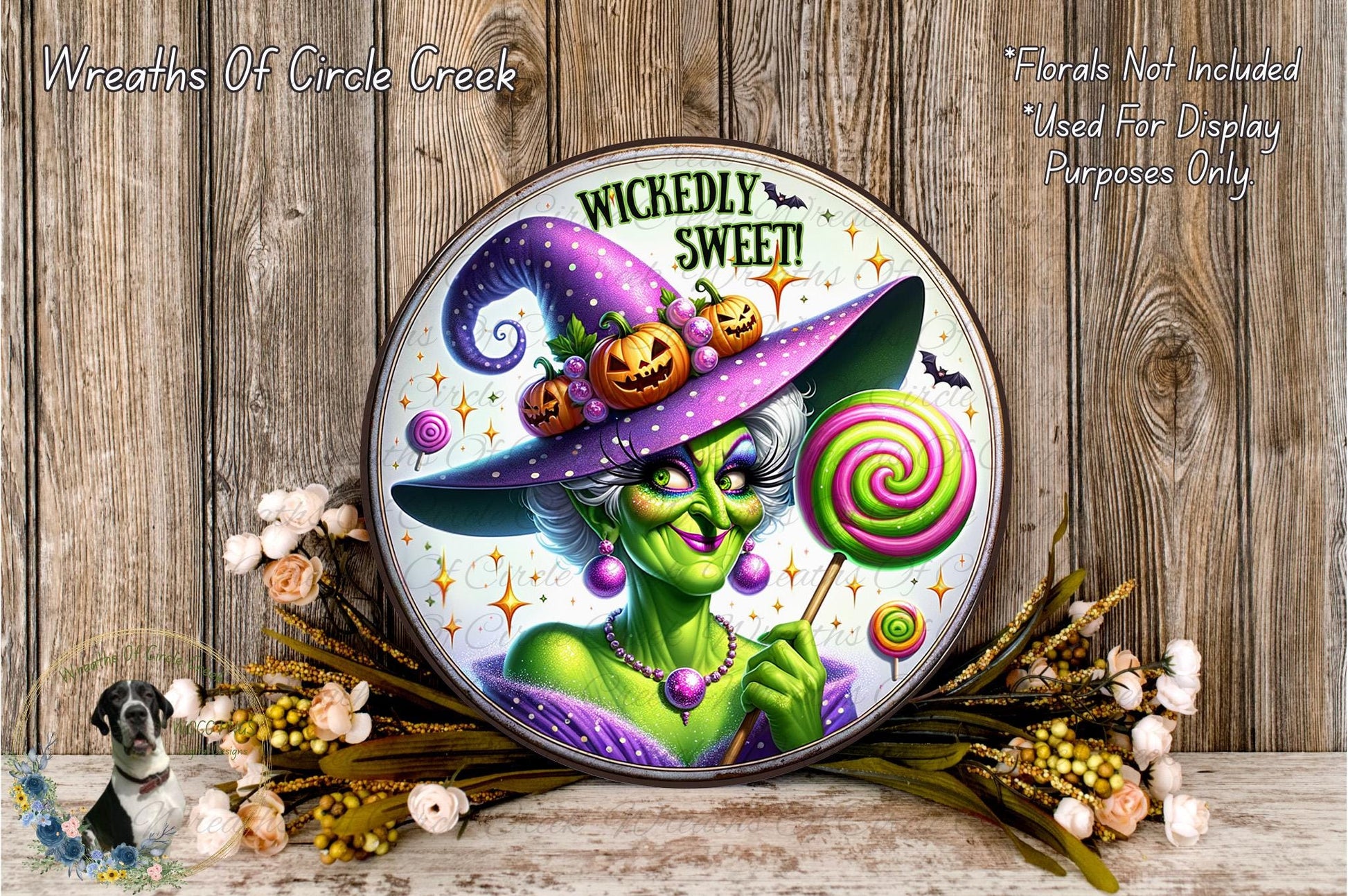 a picture of a witch holding a lollipop