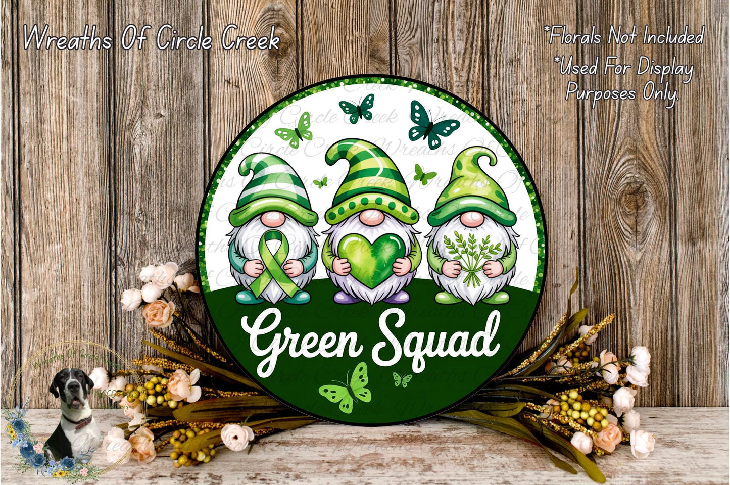 a green sign with three gnomes on it