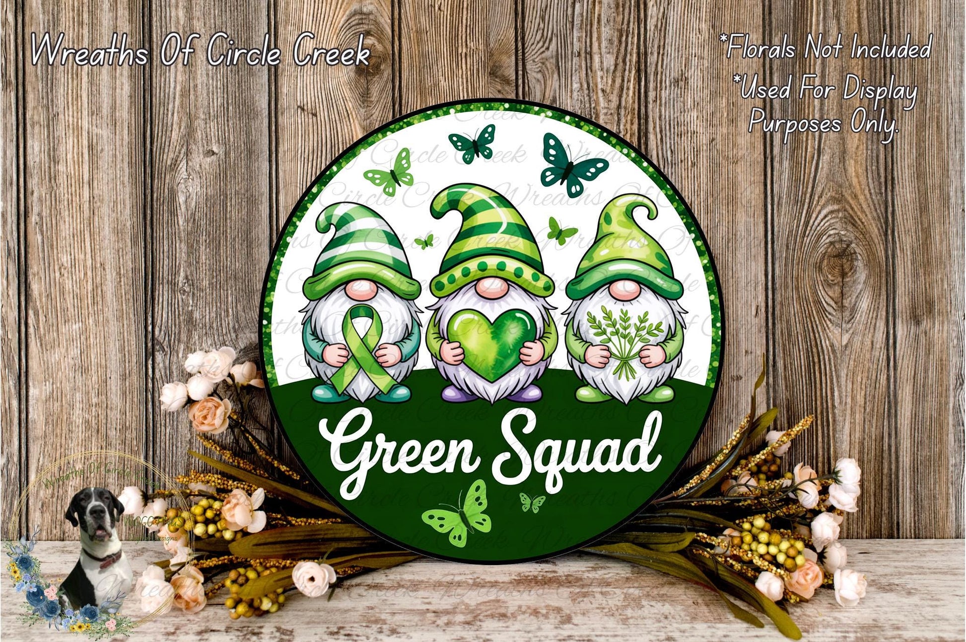 a green sign with three gnomes on it