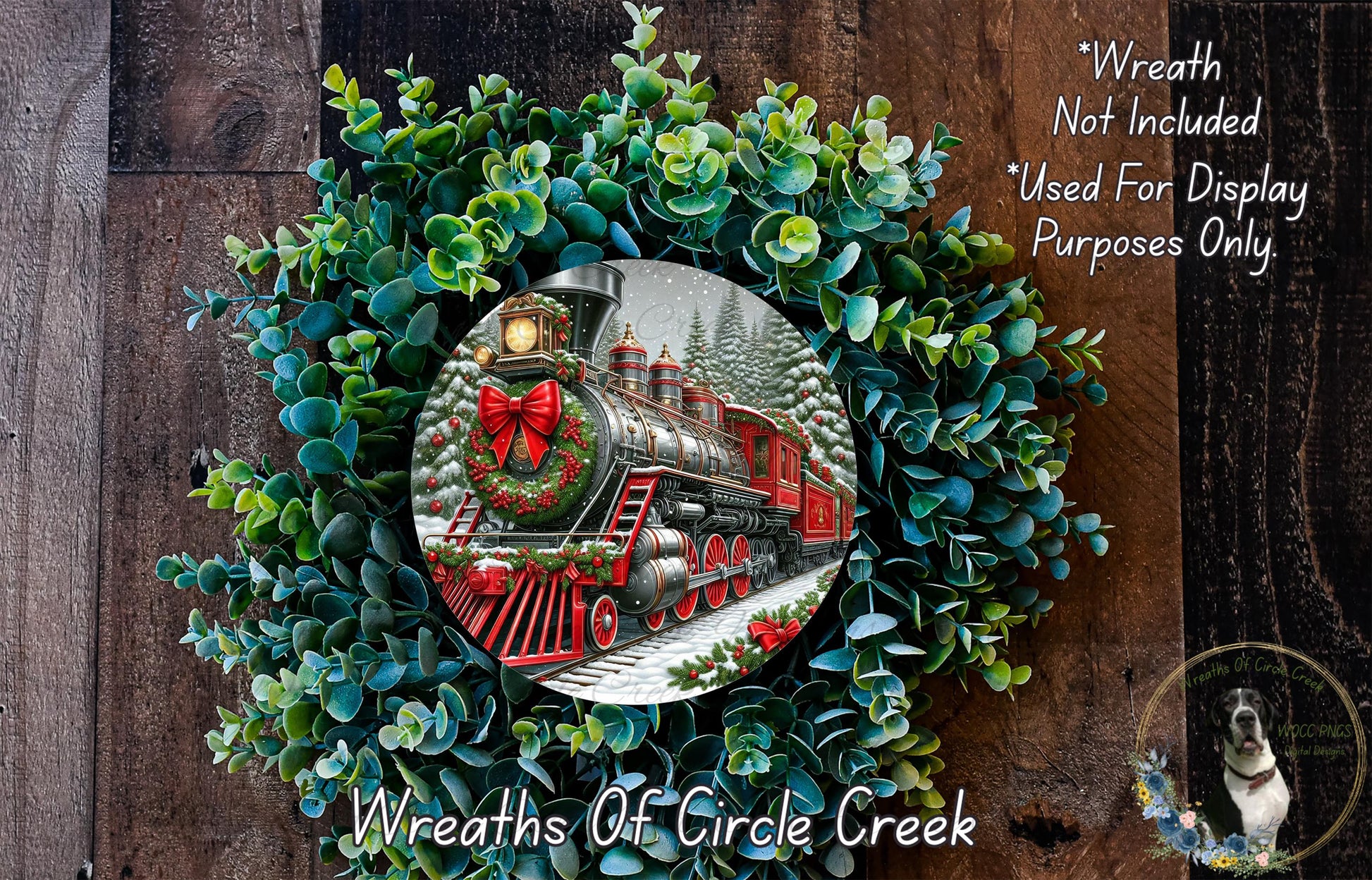 A wreath with a Christmas train engine in the center, surrounded by greenery.