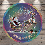 Santa Claus riding a decorated sleigh pulled by a reindeer, with a colorful, illuminated background and the text "Merry & Bright" at the bottom.