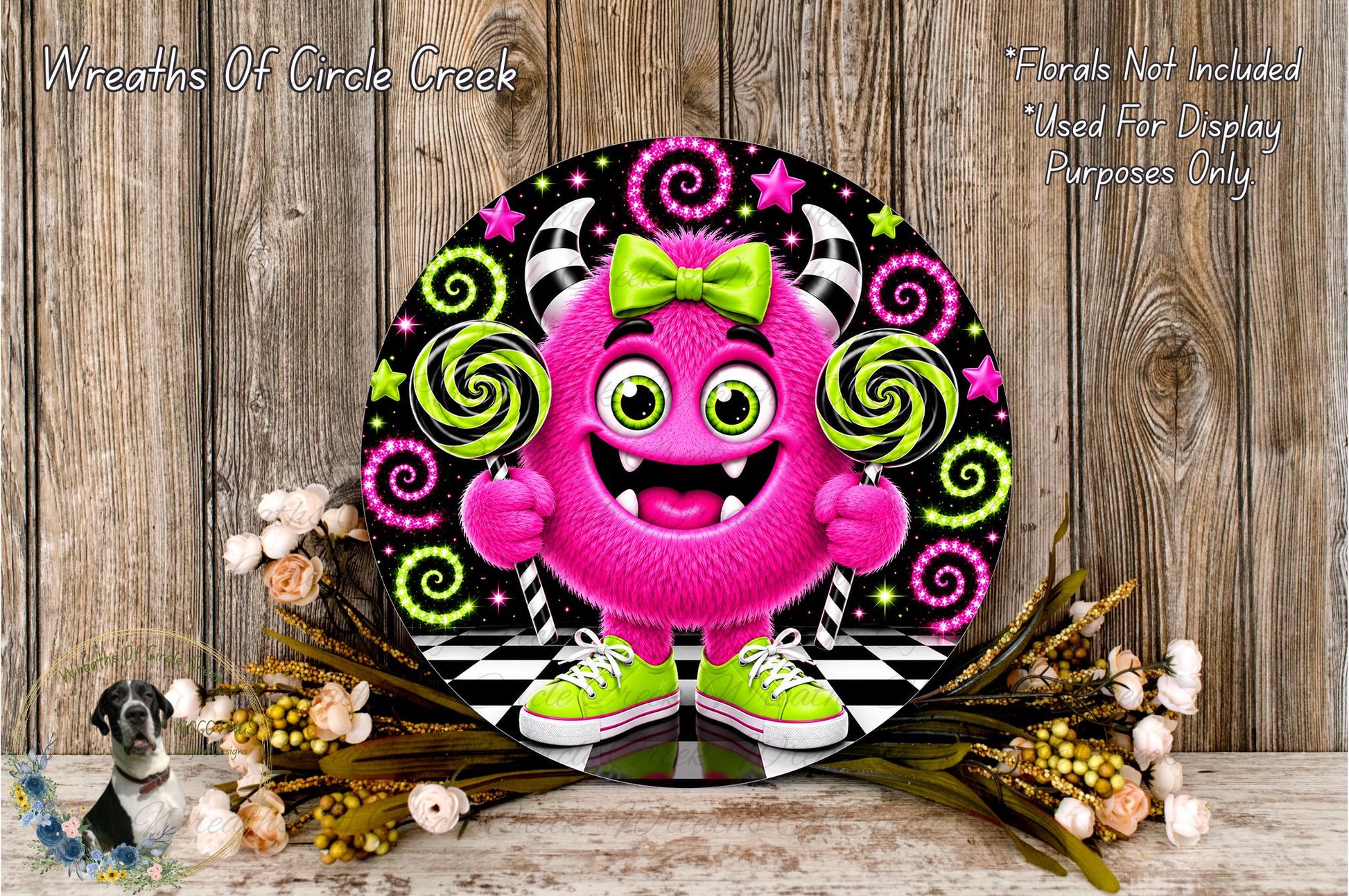A whimsical, cartoonish monster character with horns and a bow tie is surrounded by colorful spiral designs and flowers, creating a playful and festive atmosphere.