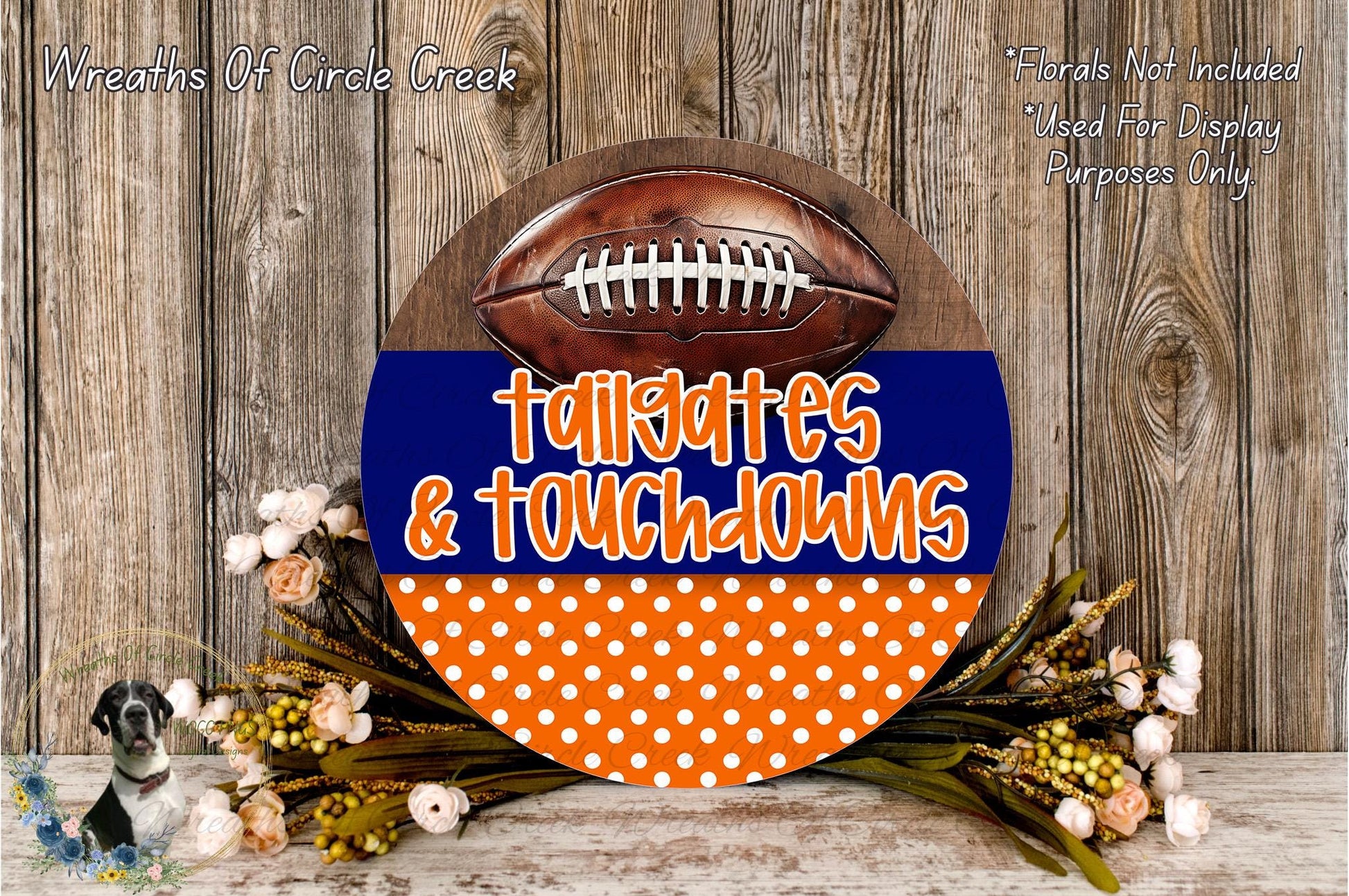 A round sign with the text "Tailgates & Touchdowns" in orange and blue, surrounded by a wreath of flowers and a football.