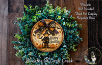 a wreath with a picture of a witch on it