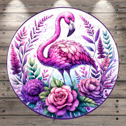 a painted plate with a pink flamingo surrounded by flowers