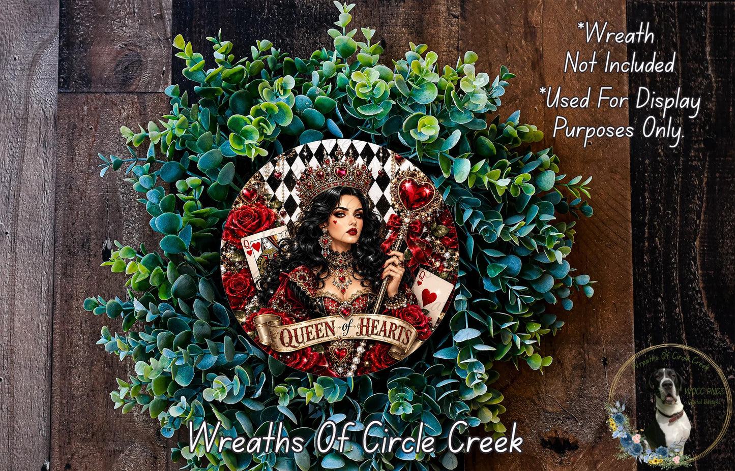 A wreath featuring a woman with long dark hair and a crown, surrounded by green leaves and red roses. The wreath has the text "Queen of Hearts" written on it.