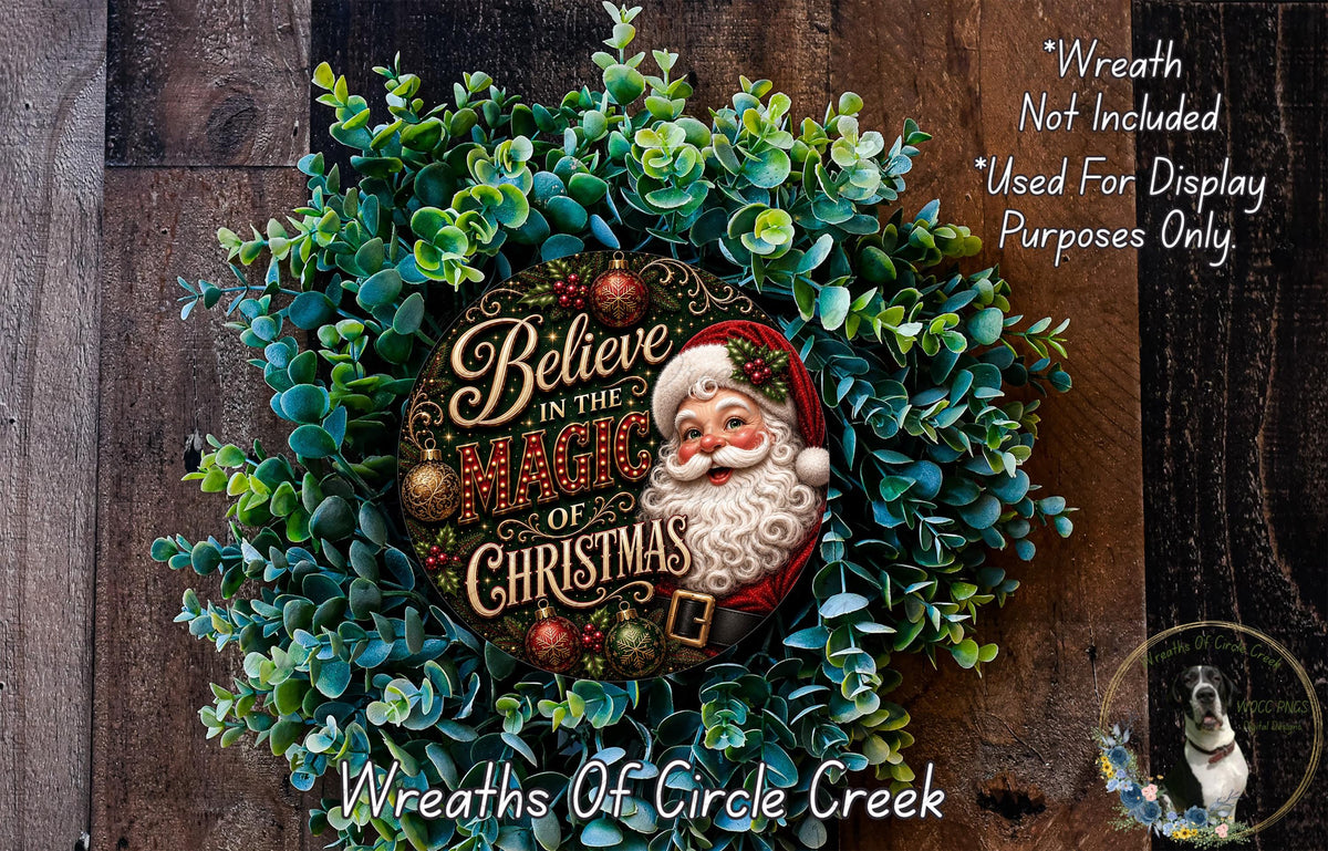 A wreath with a Santa Claus face and the text "Believe in the Magic of Christmas" is displayed on a wooden background.