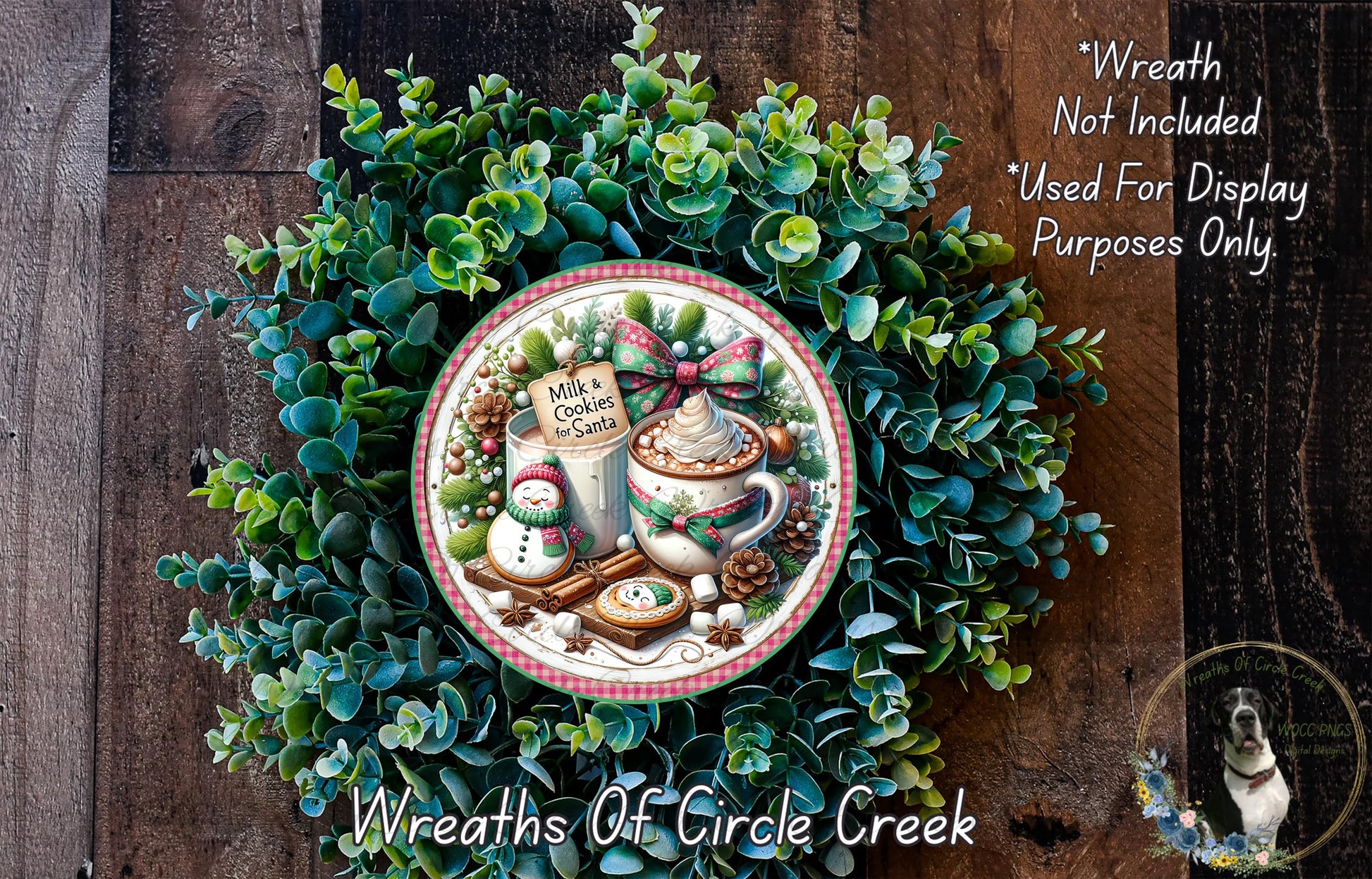 A wreath made of green leaves and other natural elements, with a decorative plate featuring a mug of hot chocolate and a snowman as the centerpiece.