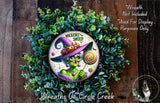 a wreath with a picture of a witch on it