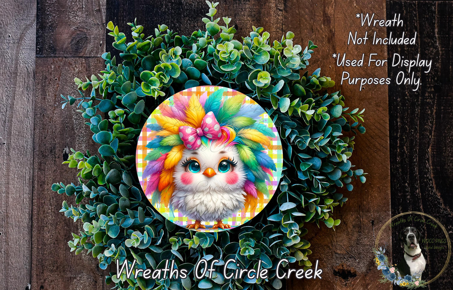A colorful wreath with a bird-like face in the center, surrounded by green foliage.