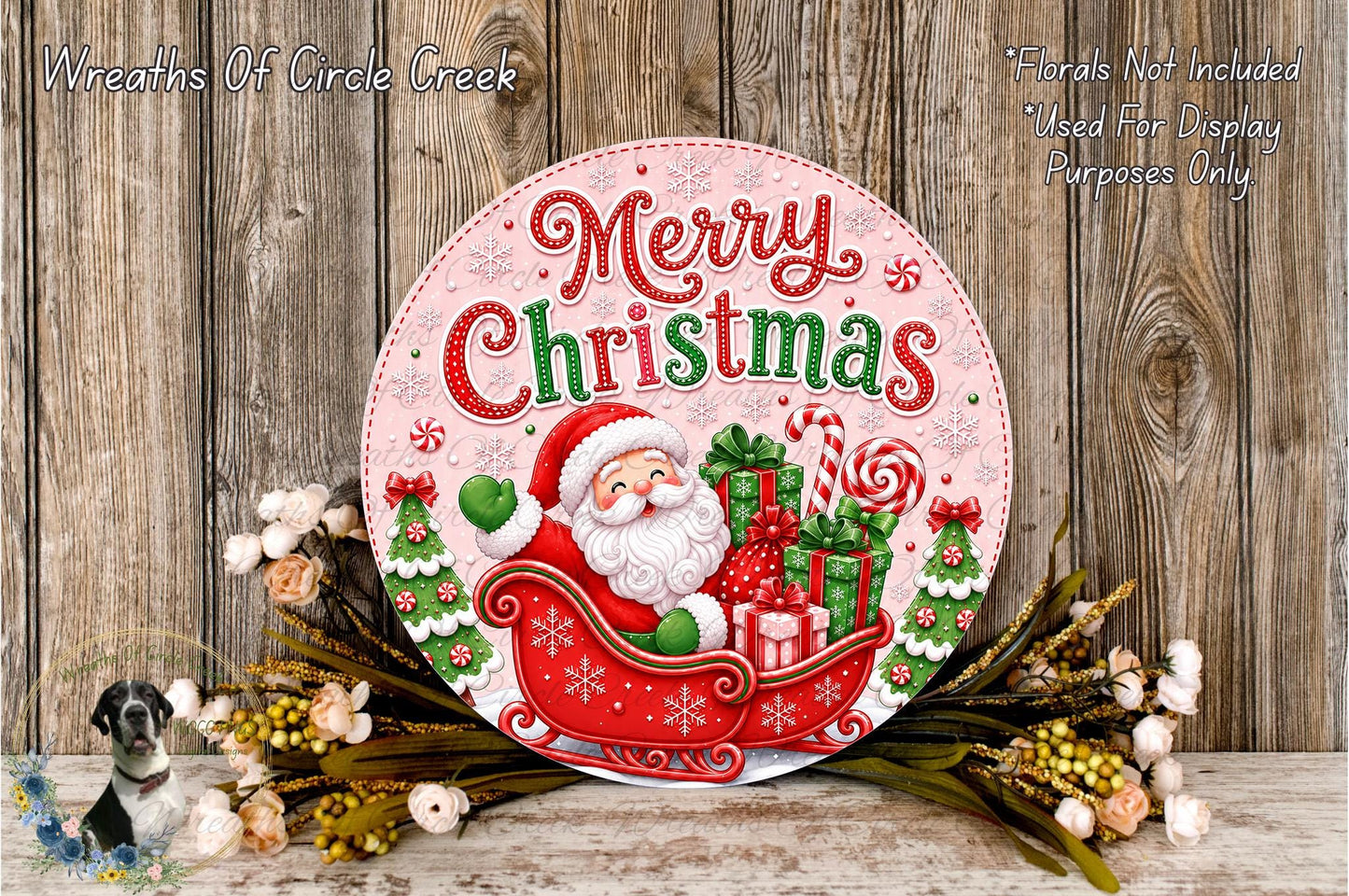 A festive Christmas-themed sign with Santa Claus riding a sleigh pulled by presents, surrounded by holiday decorations such as flowers and greenery.