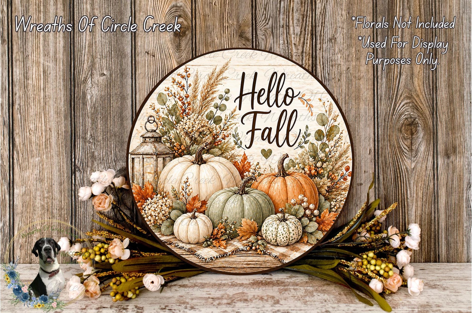a decorative round sign with a fall theme, surrounded by various fall-themed elements such as pumpkins, flowers, and leaves. The sign has the text "Hello Fall" written on it, and the background is a wooden wall with a rustic appearance.