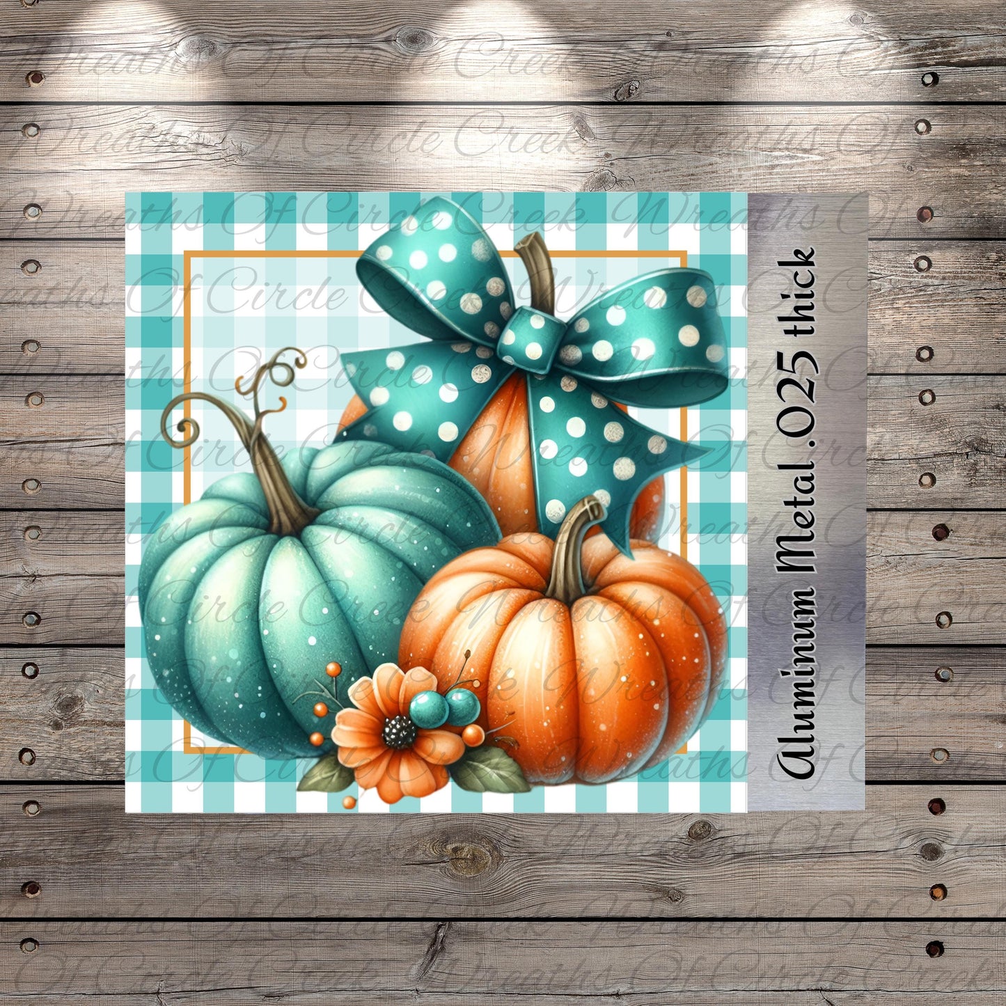 A collage of three pumpkins, one blue and two orange, with a bow on top, set against a blue and white checkered background.
