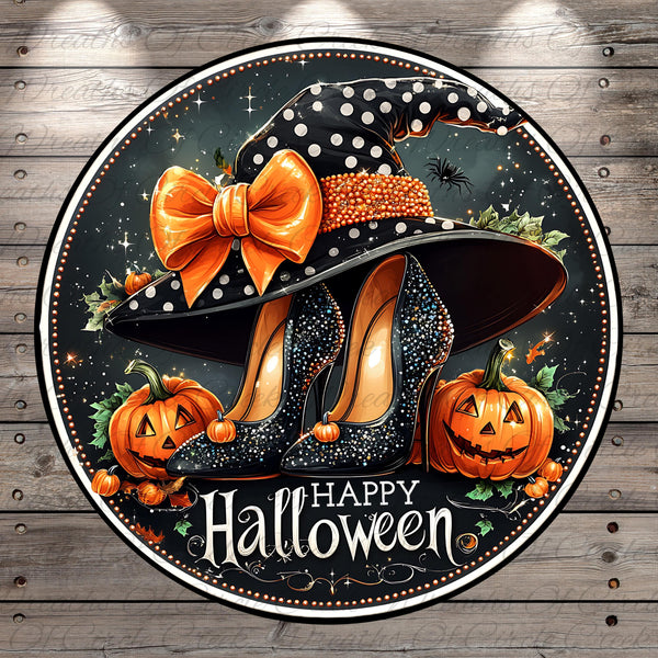 A Halloween-themed illustration featuring a witch's hat with a large bow, a pair of high-heeled shoes, two carved jack-o'-lanterns, and the text "Happy Halloween".