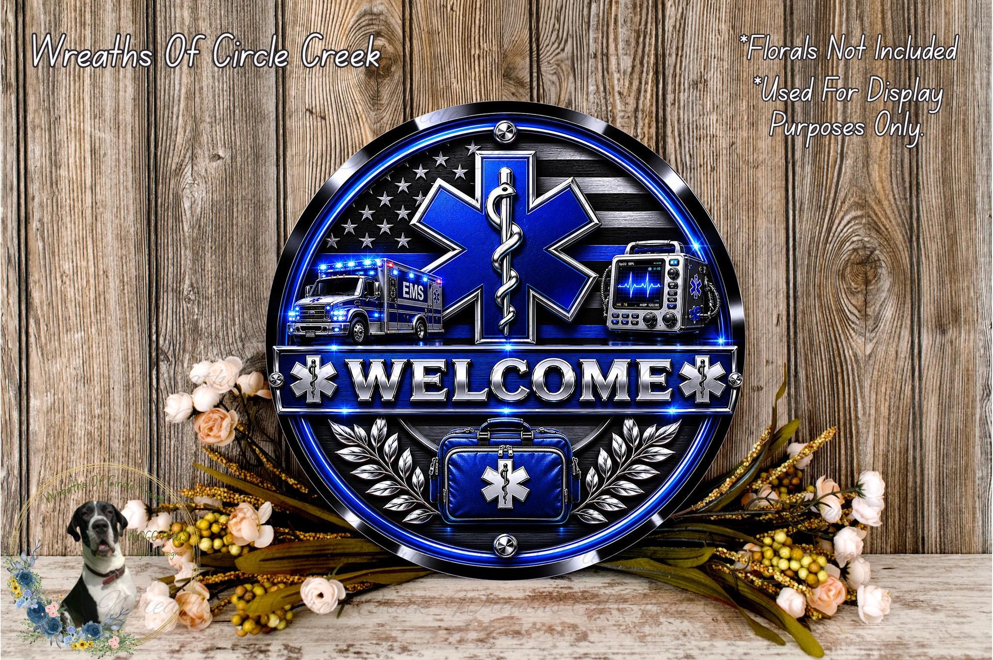 a welcome sign with a blue and silver design, surrounded by flowers and a wooden background.