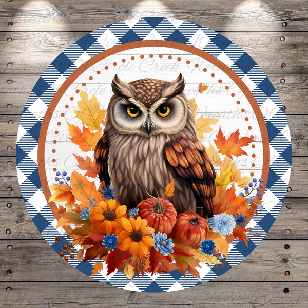A detailed illustration of an owl surrounded by autumn leaves, flowers, and pumpkins, set against a blue and white checkered background.