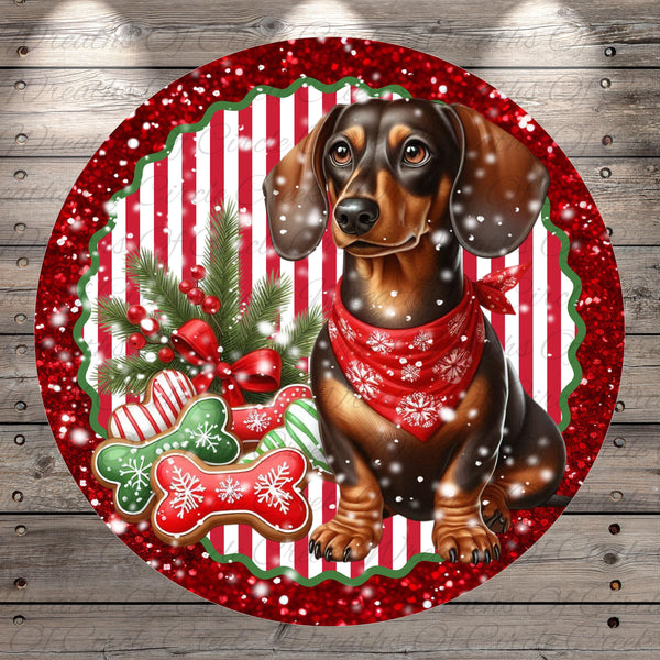 A dachshund dog wearing a red scarf and surrounded by Christmas decorations, including gingerbread cookies, pine branches, and snowflakes, all set against a red and white striped background.