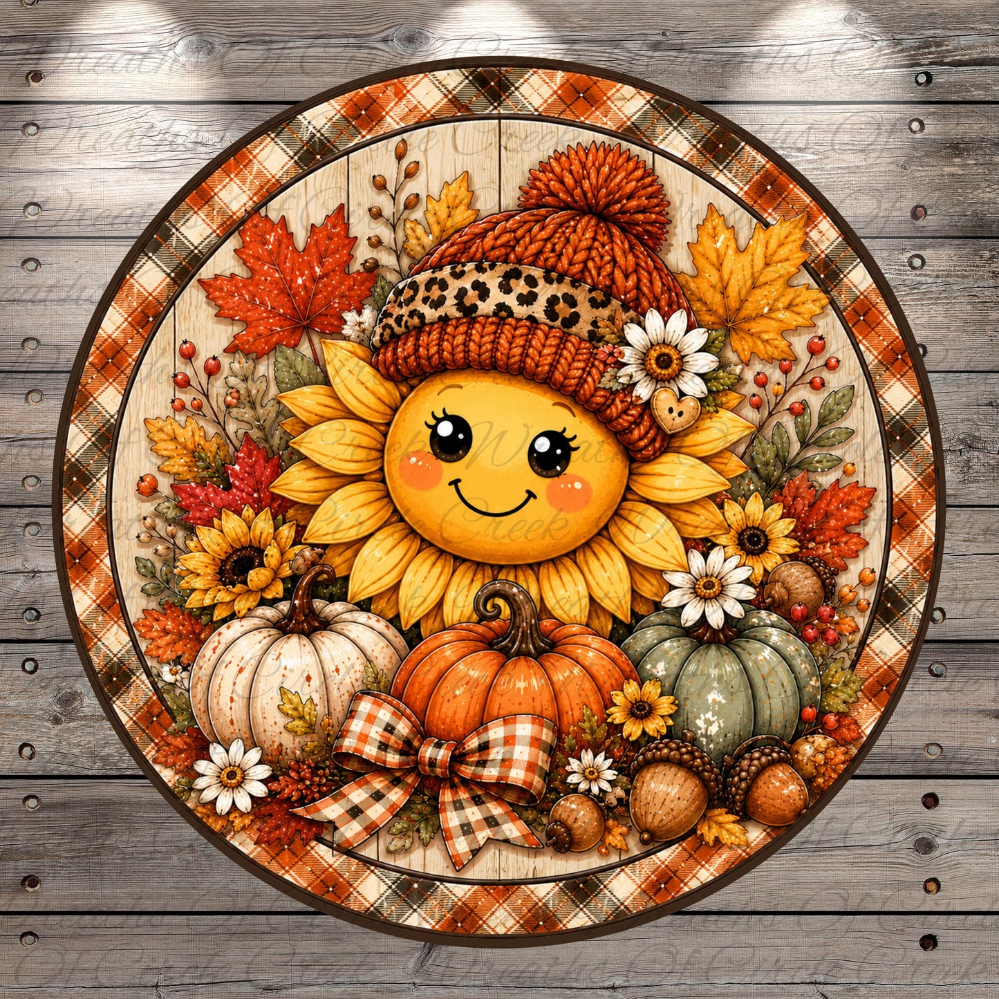 A cheerful sunflower wearing a knitted hat and surrounded by autumn decorations, including pumpkins, acorns, and leaves, all set against a wooden background.