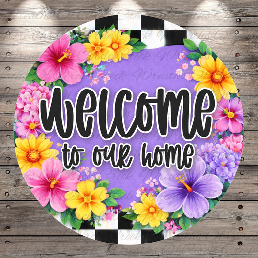 A colorful welcome sign with a floral border, featuring the text "Welcome to our home" surrounded by various colorful flowers.