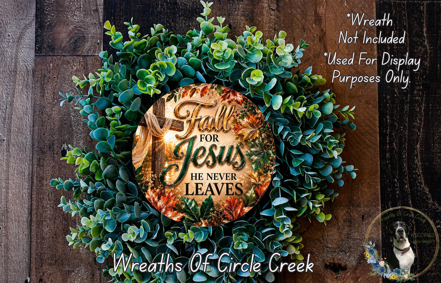 a wreath made of green leaves and a circular sign with the text "Fall for Jesus he never leaves" displayed on it.