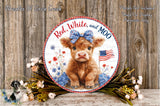A decorative plate featuring a cow with a bow, surrounded by flowers and an American flag, placed on a wooden surface.