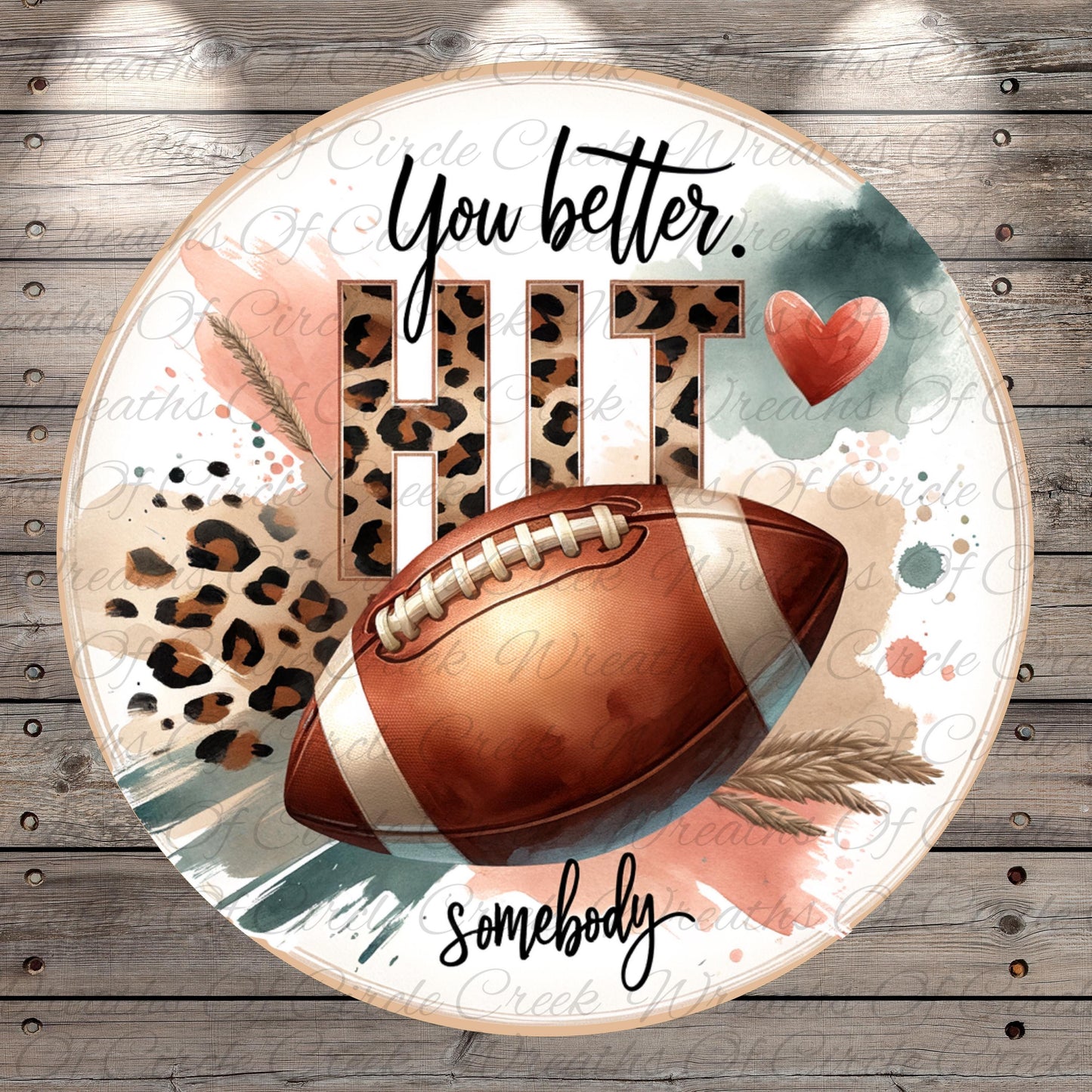 a football with a leopard print pattern, surrounded by text and a heart shape.