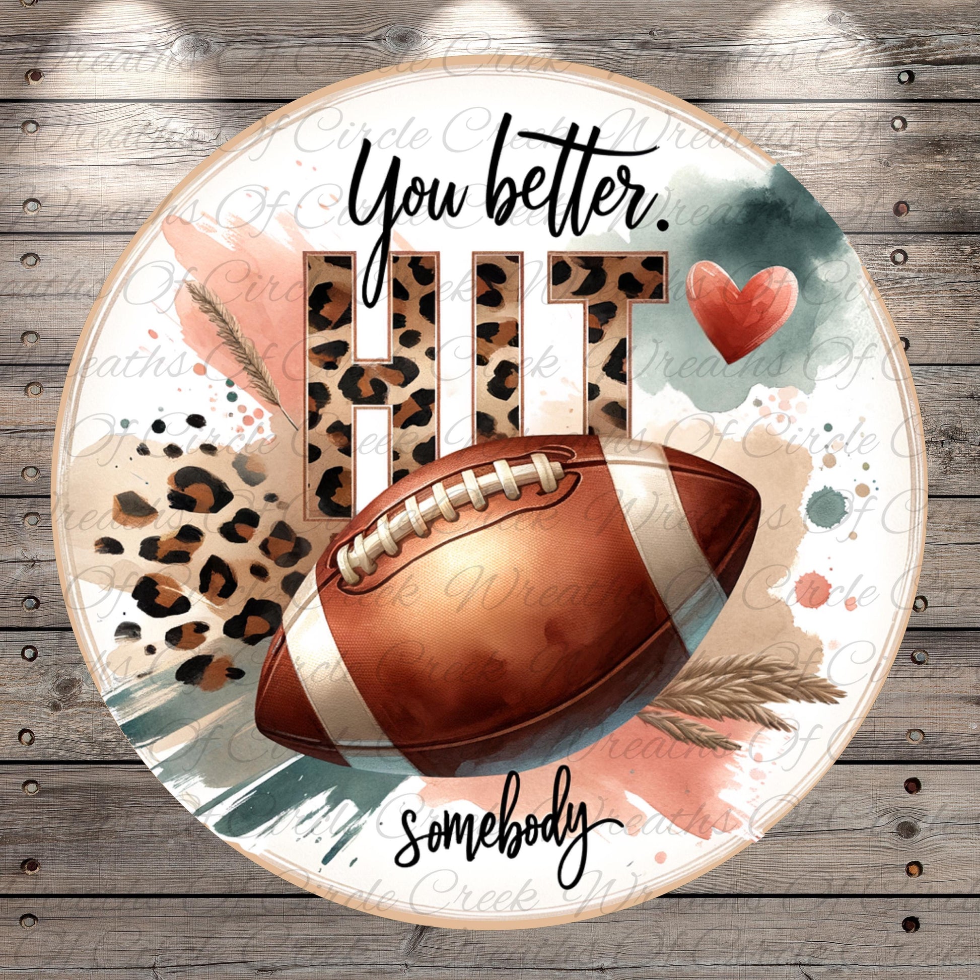 a football with a leopard print pattern, surrounded by text and a heart shape.