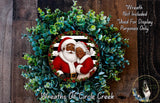 A wreath featuring Santa Claus and his reindeer, surrounded by greenery, with a caption stating that the wreath is not included in a display and is used for purposes only.