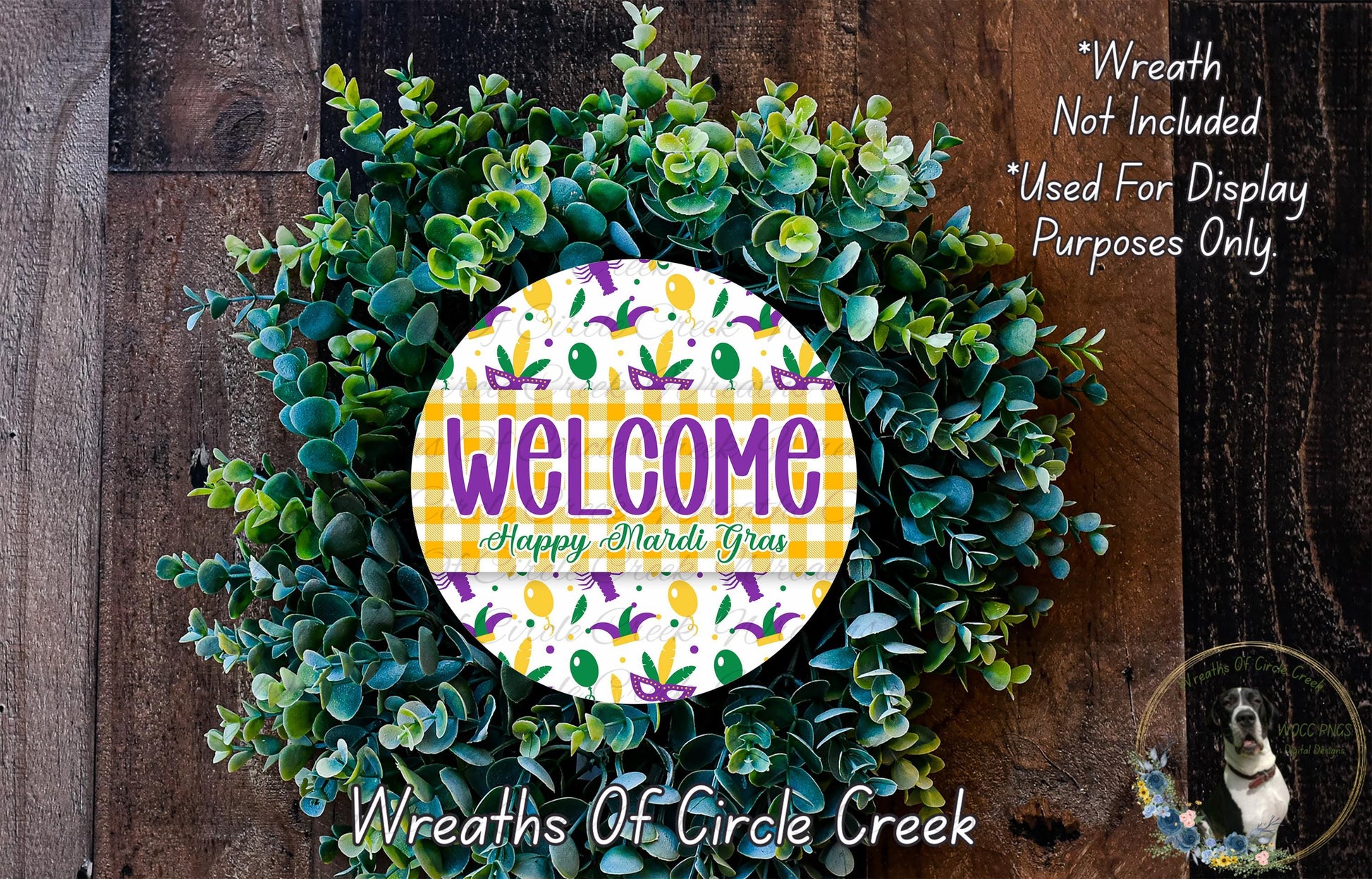 a wreath made of green leaves and flowers, with a large circular sign in the center that says "Welcome Happy Mardi Gras". The sign is surrounded by the wreath, creating a festive and welcoming atmosphere.