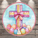 A round wreath with a large pink bow, surrounded by colorful Easter eggs and a white rabbit.