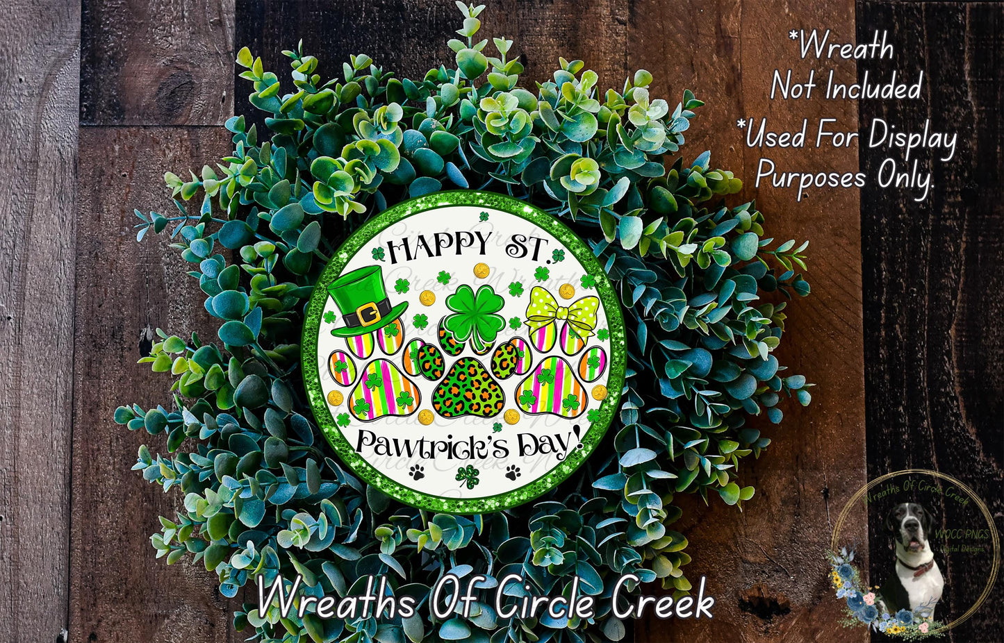 A wreath made of green leaves and featuring a circular sign with the text "Happy St. Pawtitive's Day" surrounded by various St. Patrick's Day symbols and a dog.