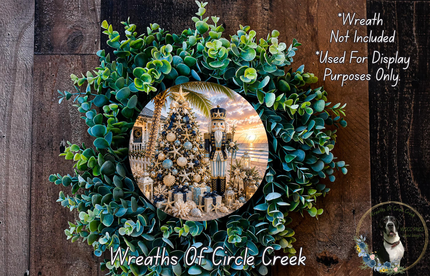 A wreath made of green leaves and branches, with a circular frame containing a photograph of a Christmas tree and nutcracker.