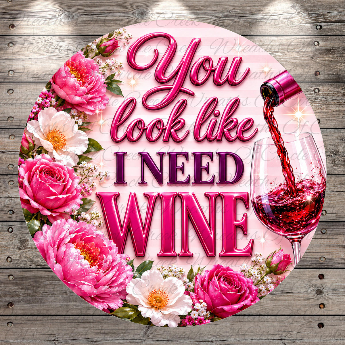 a circular design with a pink background and floral elements surrounding the text "You look like I need wine".