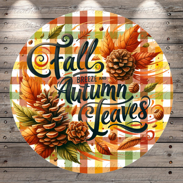 a circular design with a checkered pattern and autumn-themed elements, including pine cones, leaves, and pineapples. The text "Fall Breeze and Autumn Leaves" is prominently displayed in the center of the design.