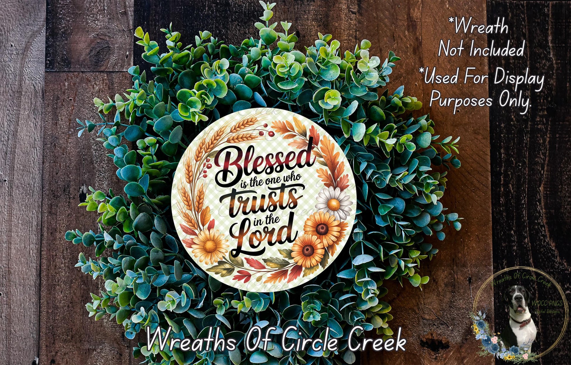 A wreath made of various green and brown foliage, with a circular plaque featuring a quote about trust and the Lord.