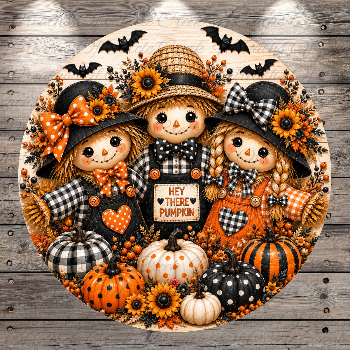 A decorative round wreath featuring three scarecrow dolls, pumpkins, and sunflowers, with the text "Hey there pumpkin" displayed on the wreath.