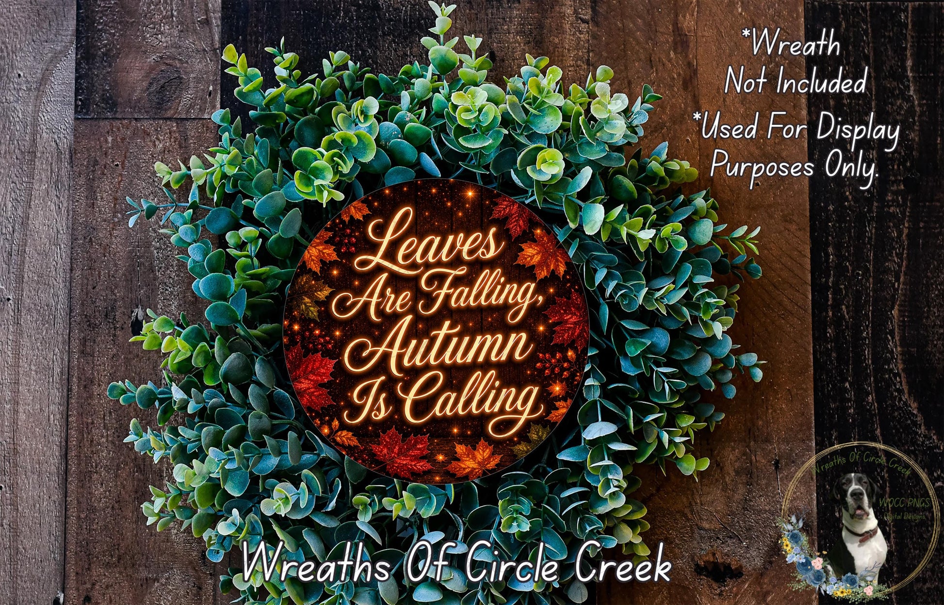 a wreath made of green leaves and a red circular sign with the text "Leaves Are Falling, Autumn Is Calling" written on it.