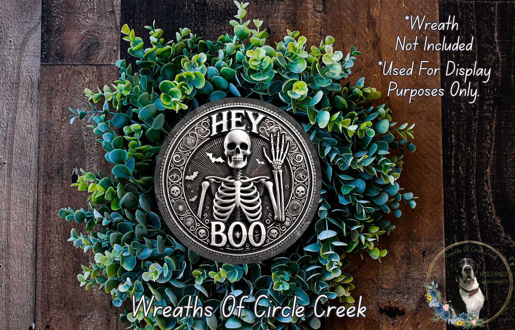 a wreath with a skeleton on it on a wooden surface