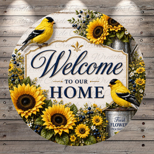 A circular sign with a welcoming message, surrounded by sunflowers and birds, against a wooden background.