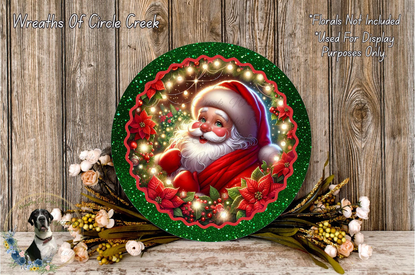 A festive Christmas wreath featuring a smiling Santa Claus surrounded by colorful flowers and greenery, placed on a wooden surface.