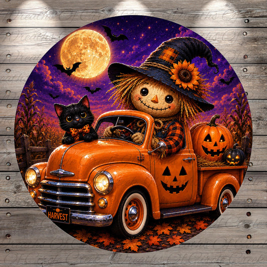 A Halloween-themed image featuring a scarecrow in a witch's hat driving an orange truck with a black cat and jack-o-lanterns in the bed.