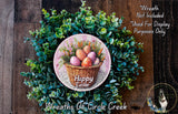 a wreath made of green foliage and a basket filled with colorful Easter eggs, with the text "Happy Easter" displayed on the wreath.