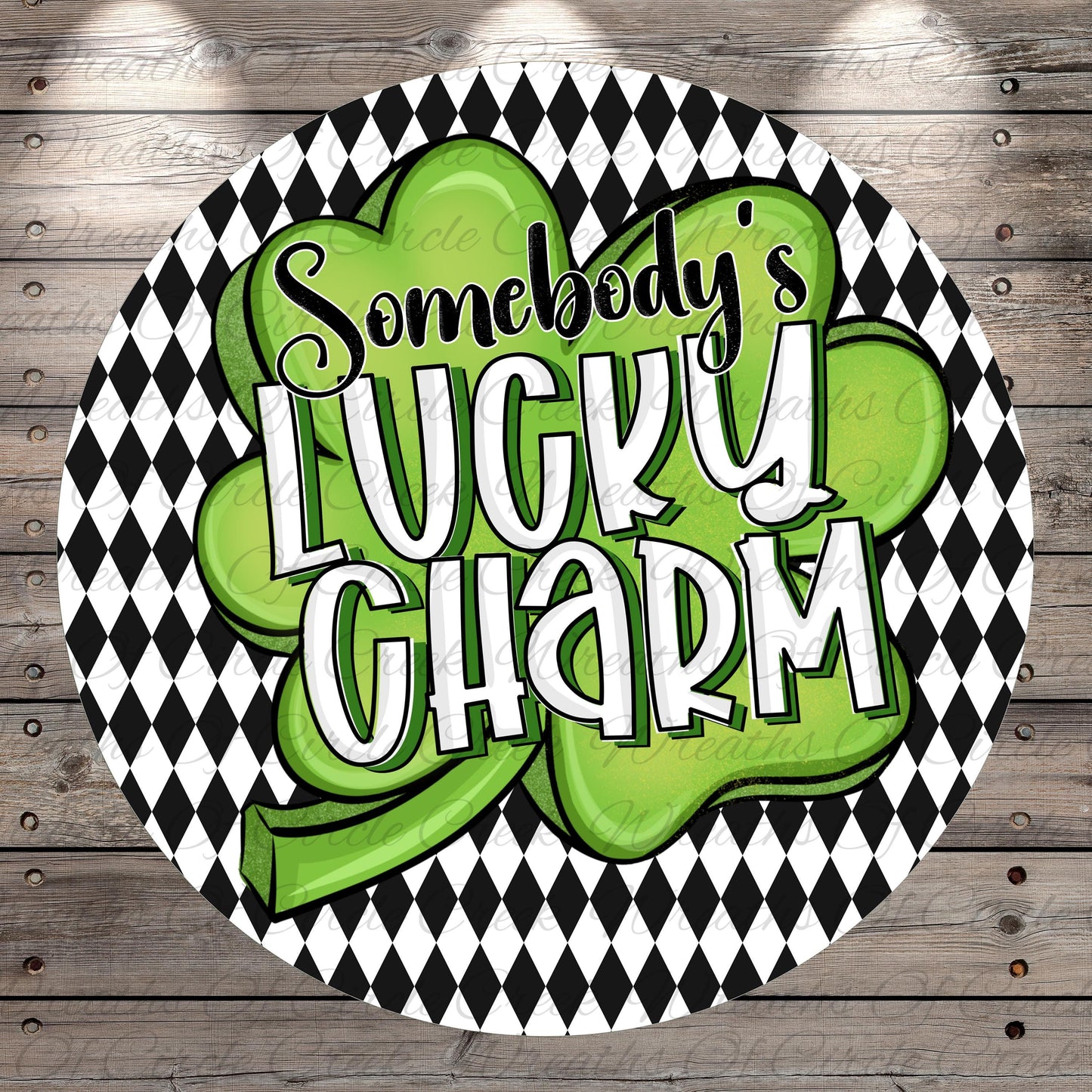 a circular design with a black and white checkered pattern and a green clover-shaped symbol. The text "SOMEBODY'S LUCKY CHARM" is prominently displayed in the center of the design.